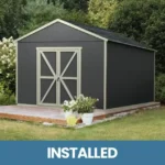 10x10 storage shed featuring black siding and a matching black roof, set against a natural backdrop