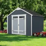 10x8 Outdoor Wood Storage Shed,small gray shed featuring a white door, set against a natural backdrop, showcasing a simple and functional design