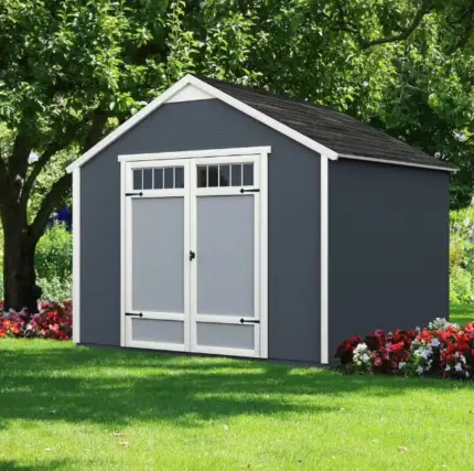 10x8 Outdoor Wood Storage Shed,small gray shed featuring a white door, set against a natural backdrop, showcasing a simple and functional design